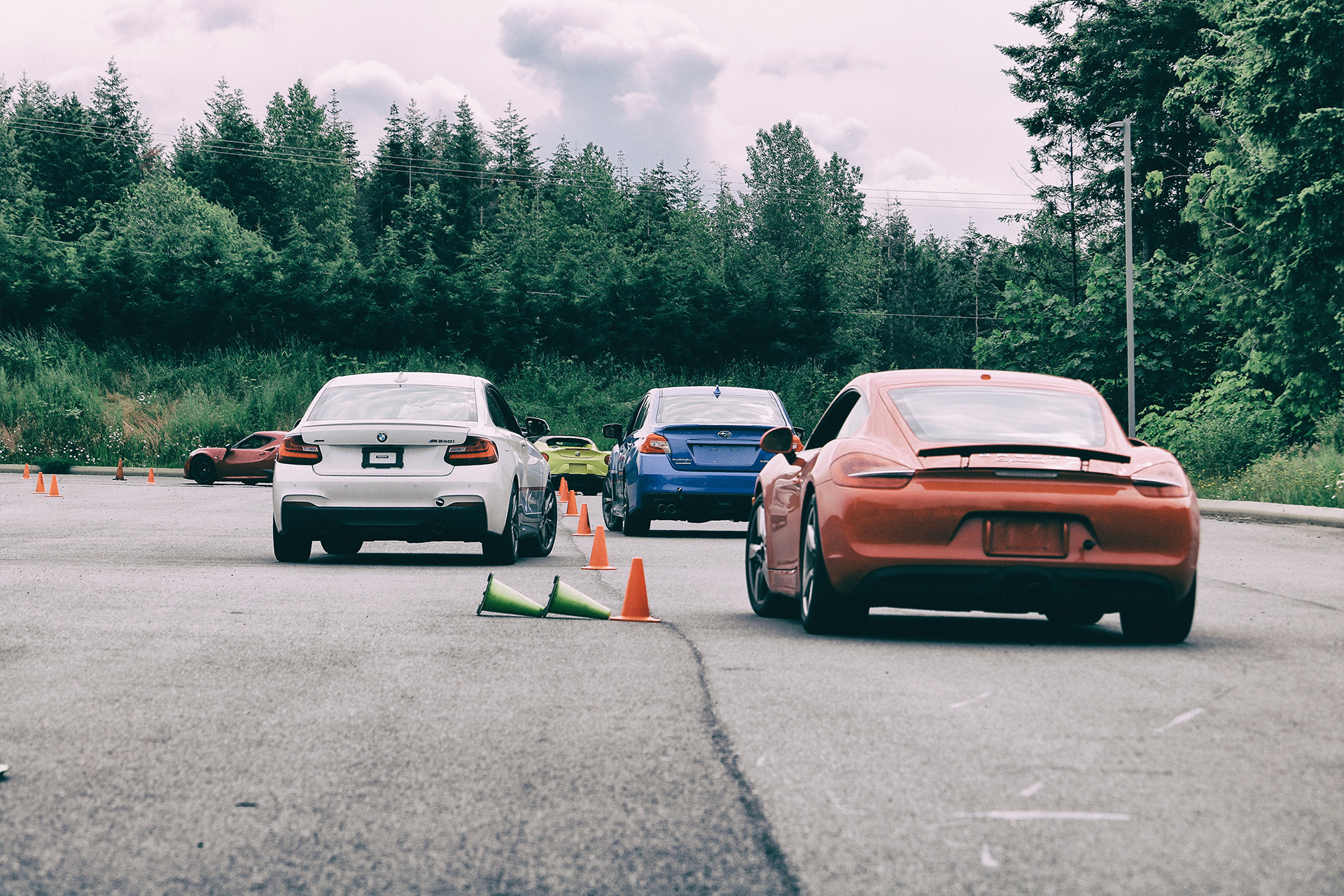 Lead-follow instruction session on track during High Performance Driving Essentials