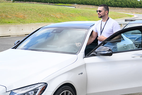 Man getting into car at the Vancouver Island Motorsport Circuit